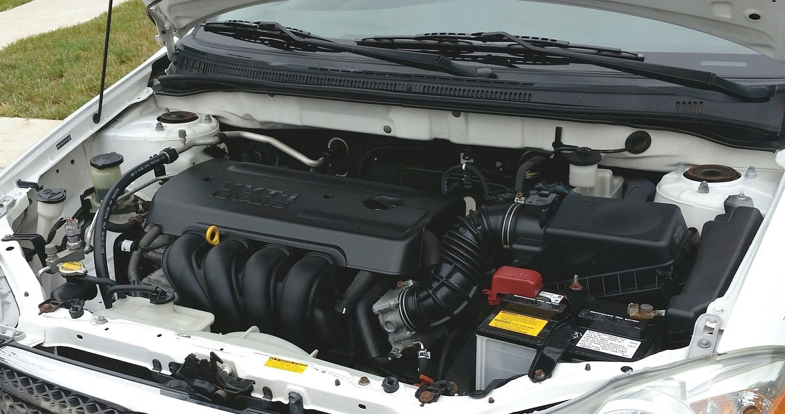 photo of car engine with focus on battery
