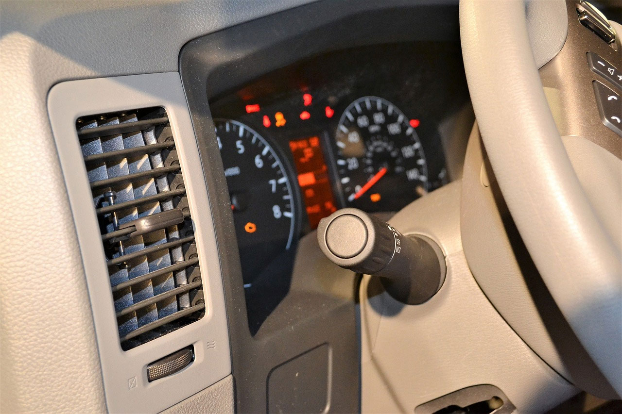 photo of car speedometer and air conditioner zoom